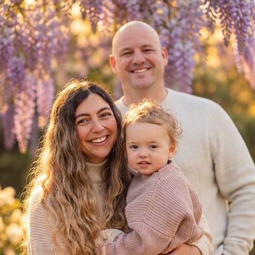 Family under wisteria at golden hour